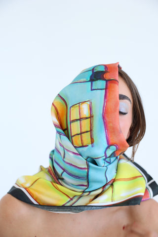Model wearing the Eloise Silk Scarf wrapped around the head and neck