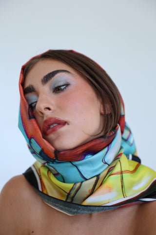 Model wearing the Eloise Silk Scarf wrapped around the head and neck