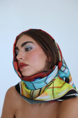 Model wearing the Eloise Silk Scarf wrapped around the head and neck